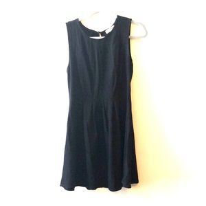 Black sleeveless pleated flare dress